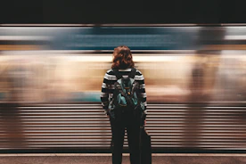 person standing in front of train station