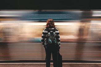 person standing in front of train station