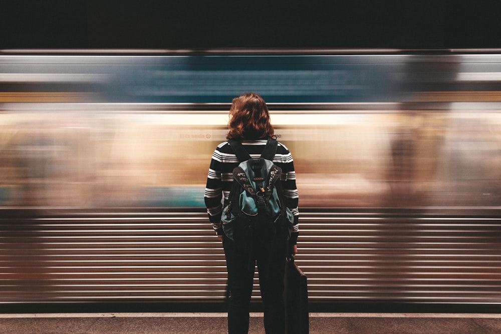person standing in front of train station