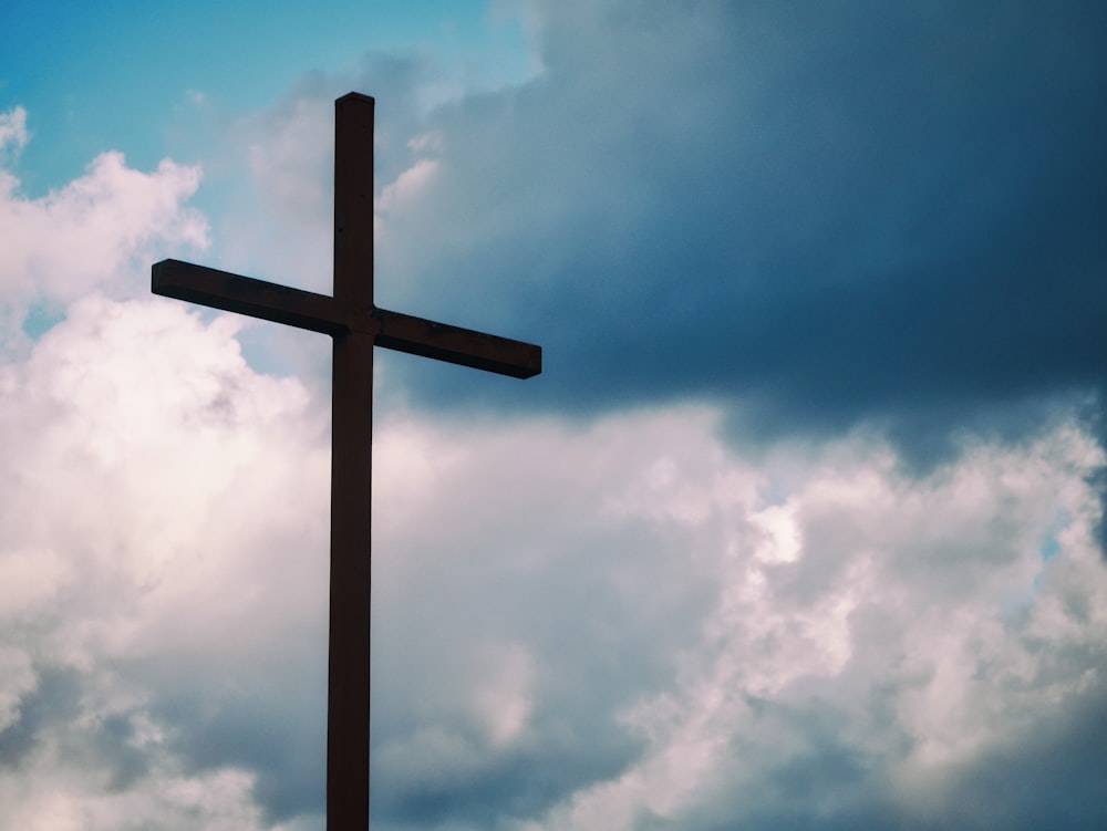 black cross under blue sky