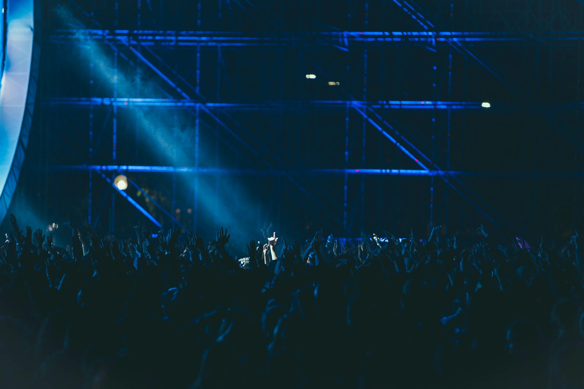 group of people raising hands inside building