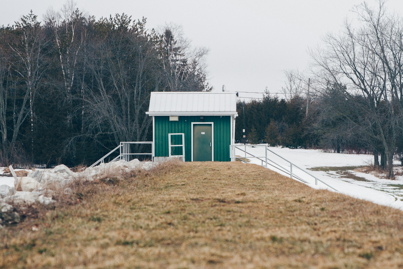 Canon EF 28-105mm f/3.5-4.5 USM sample photo. Green house near trees photography