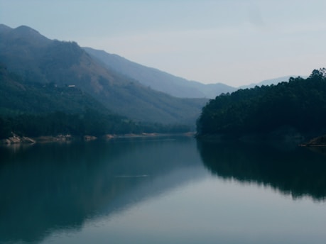 A serene landscape of Kottayam, Kerala, showcasing lush greenery and tranquil waters.