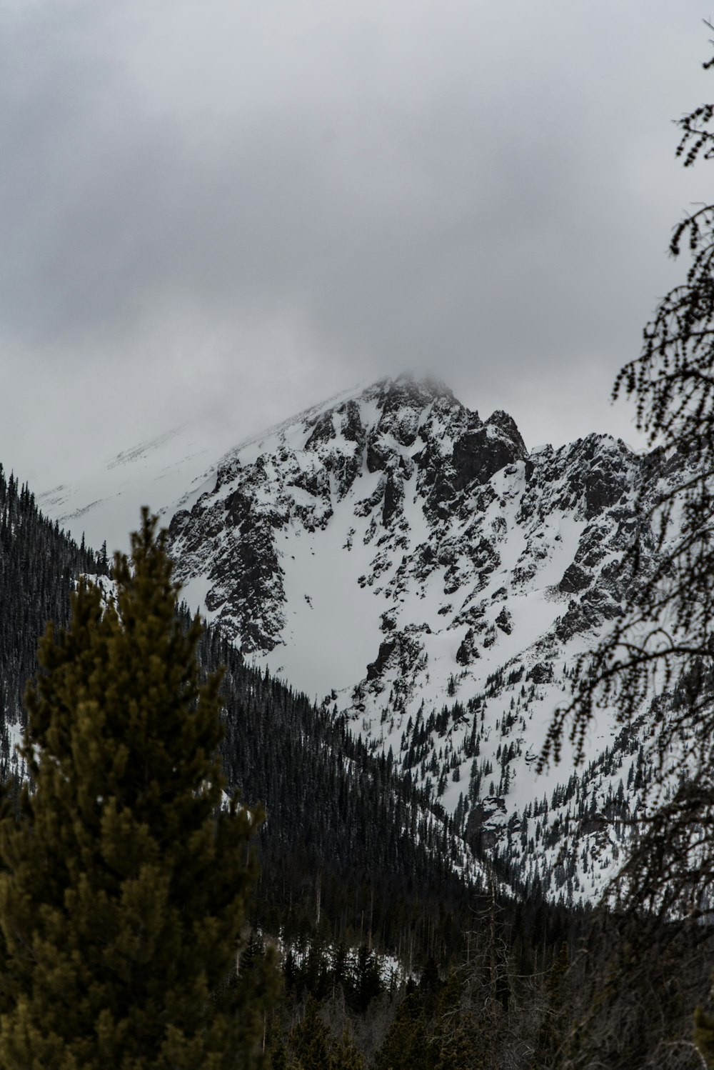 mountain alps under cloudy sky