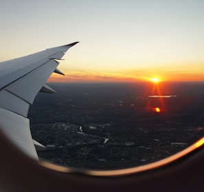 airplanes window view of sky during golden hour