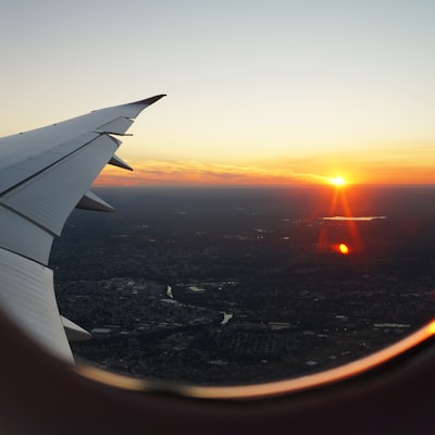 airplanes window view of sky during golden hour