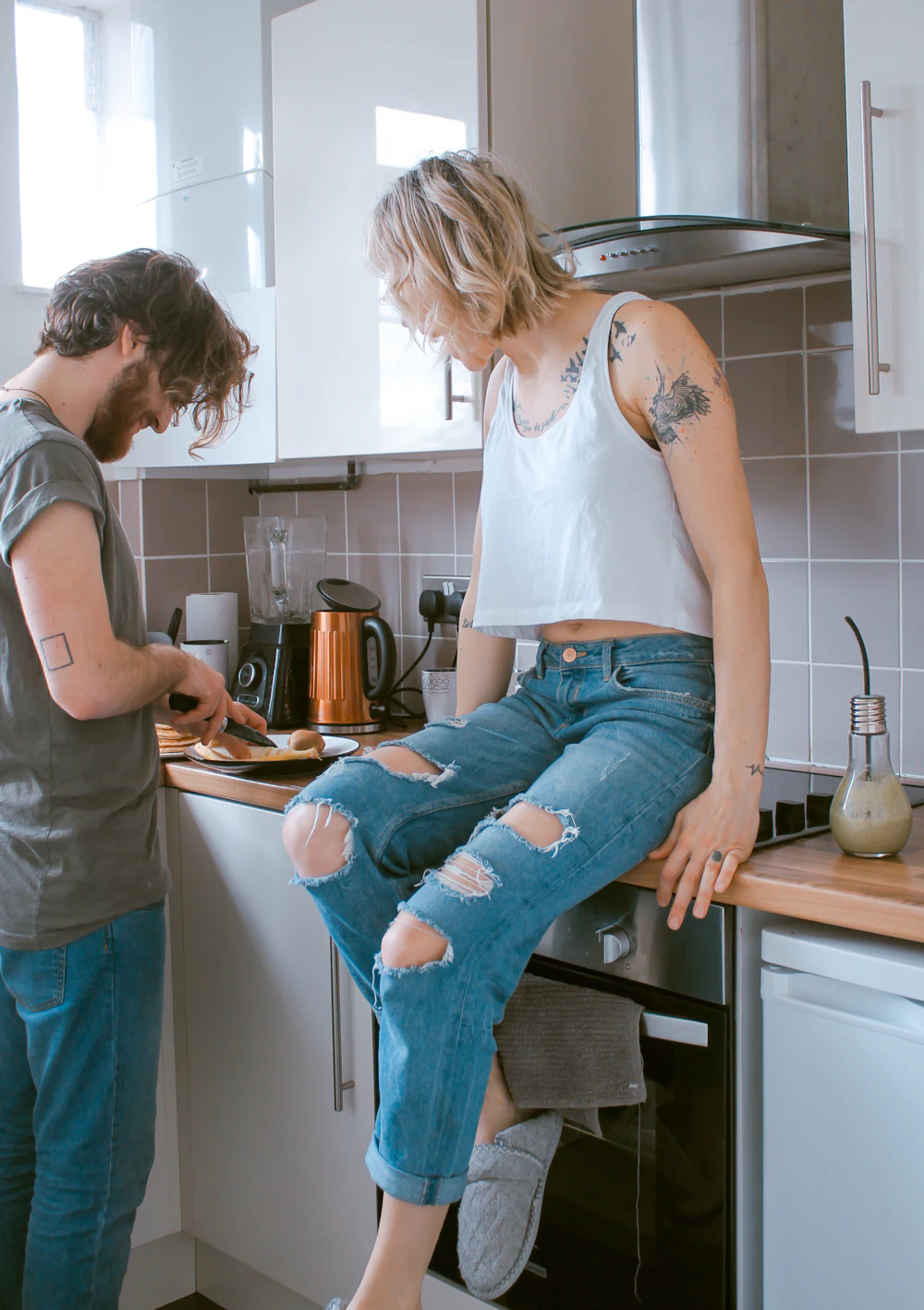 A couple at home in their kitchen