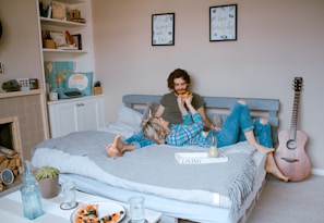 man and woman lying on bed