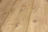 Uniform wooden planks with a natural grain and knots visible, displaying a smooth surface and light brown color. The texture and subtle variations in the wood give it a natural and rustic appearance.