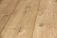 Uniform wooden planks with a natural grain and knots visible, displaying a smooth surface and light brown color. The texture and subtle variations in the wood give it a natural and rustic appearance.