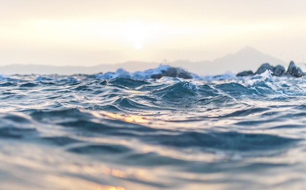 a photo of blue body of water with waves