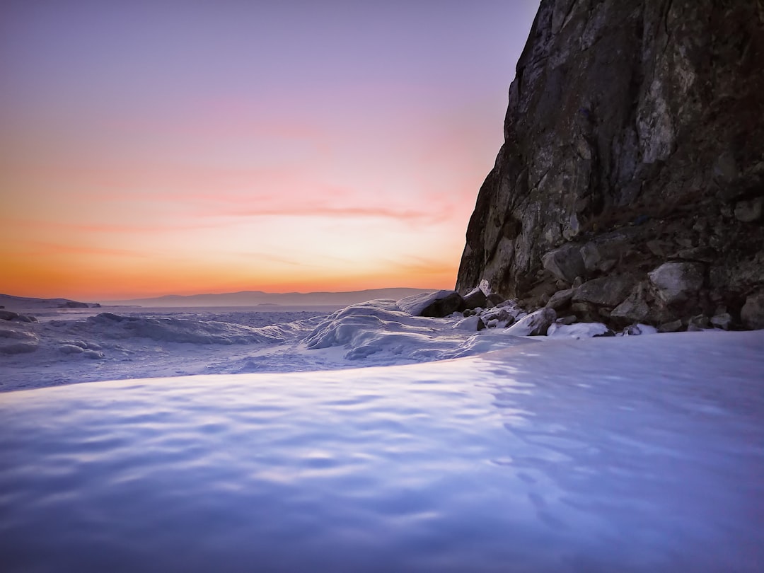 ice covered land near mountain