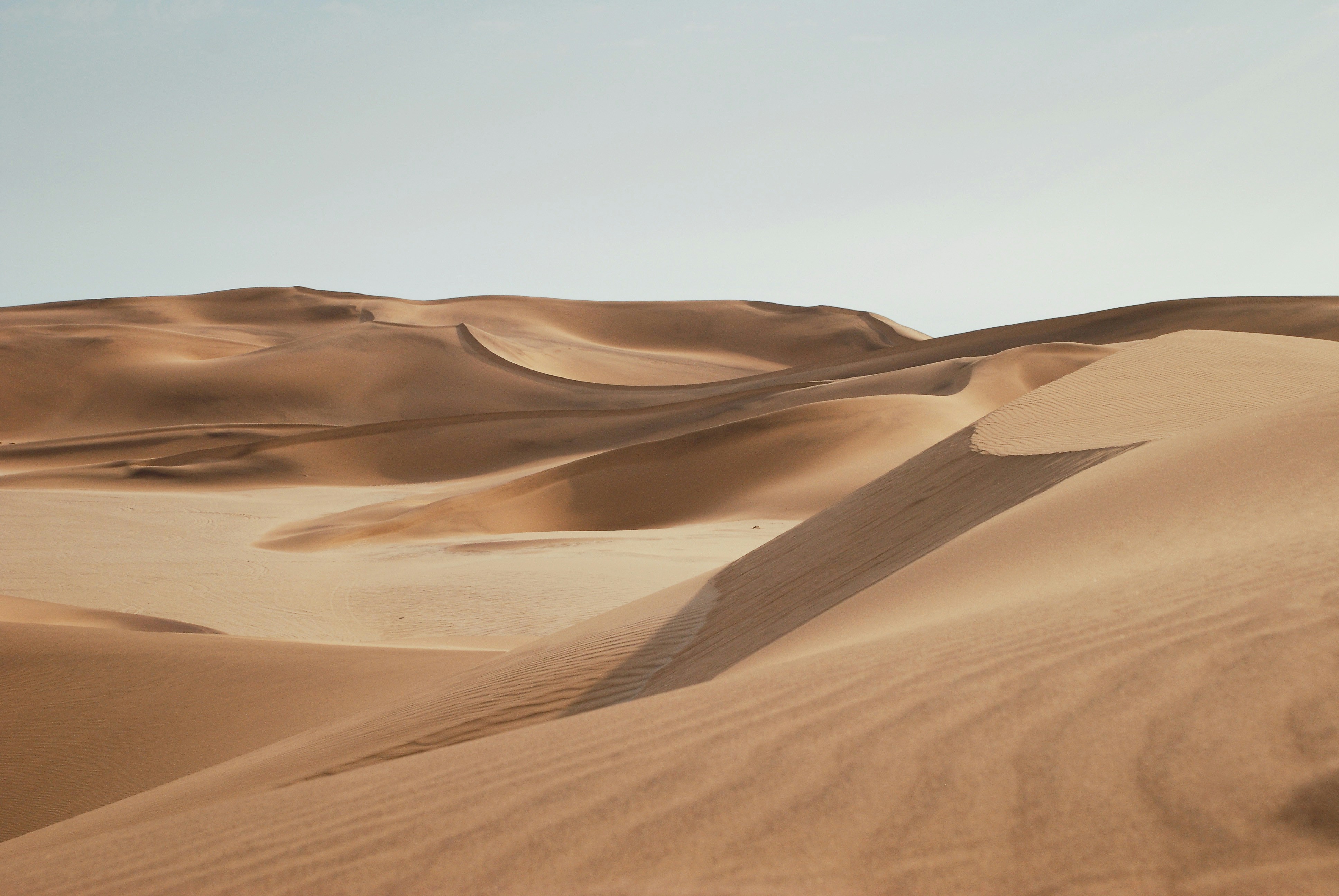 I was in Namibia directing a professional stills and video crew for a commercial commission. Tracks can take months to be erased by the wind so we had to trek for miles around potential scenes so no to disturb the pristine sand dunes.