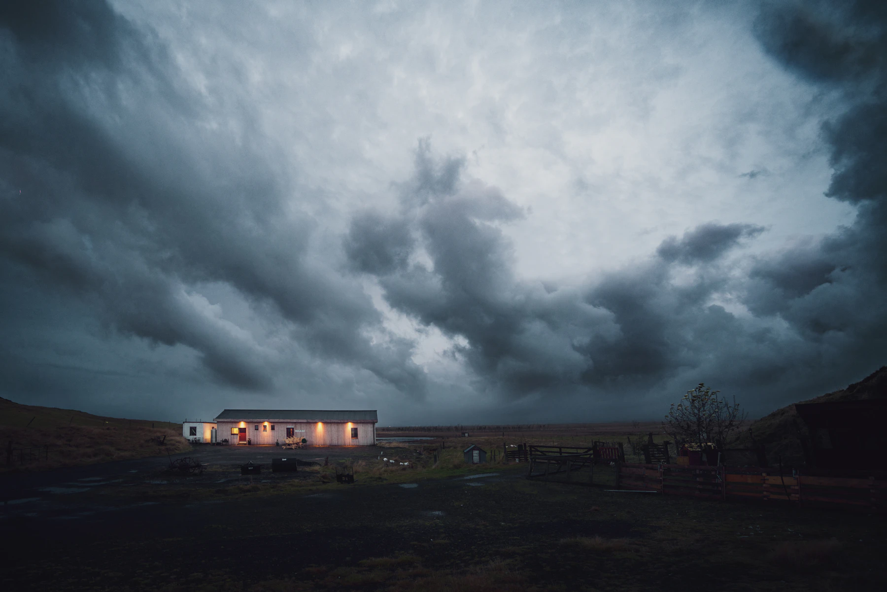 Dark storm clouds over an Austin residential neighborhood