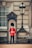A British security officer in uniform standing confidently at a busy London event entrance.