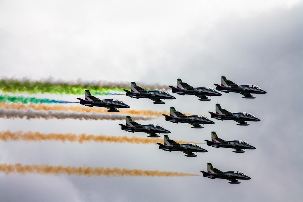 black jetpanes under white clouds