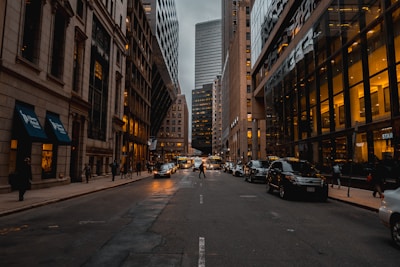 A bustling city street captured in warm evening light.