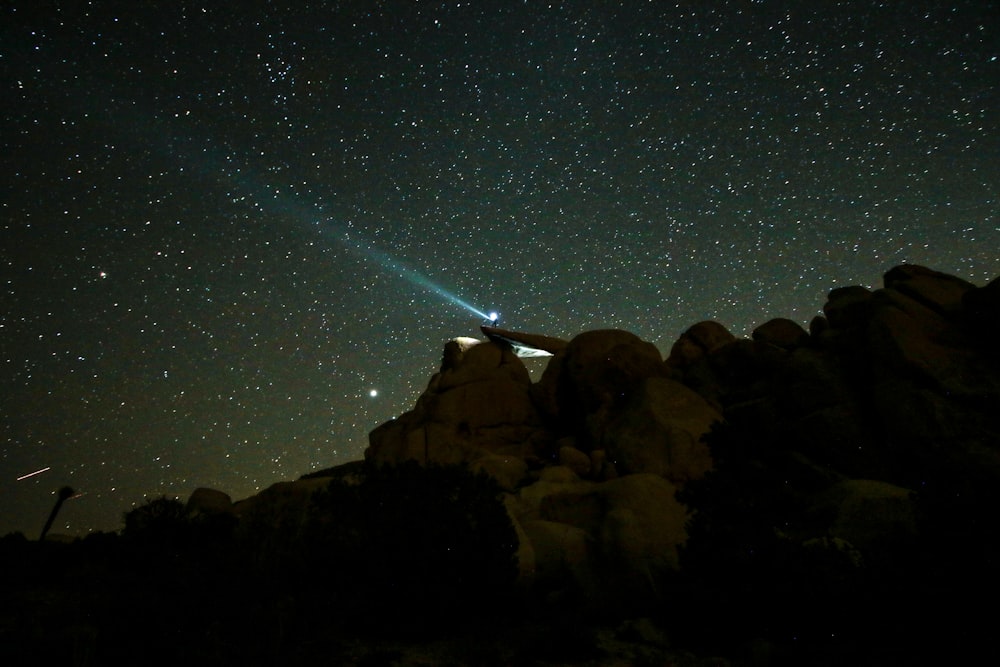 rock formations under starry night