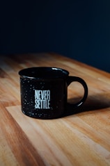 black ceramic mug on table