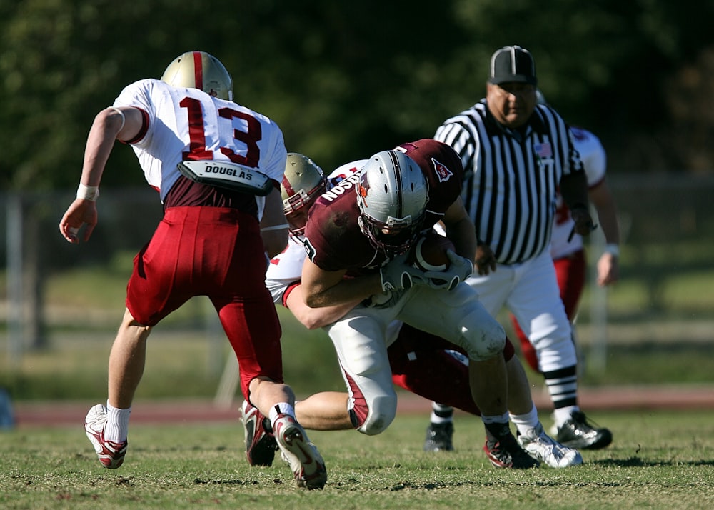 football players on green grass field