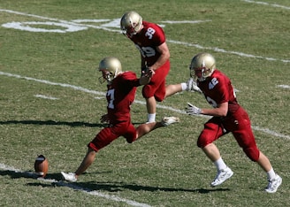 football player doing goal kick