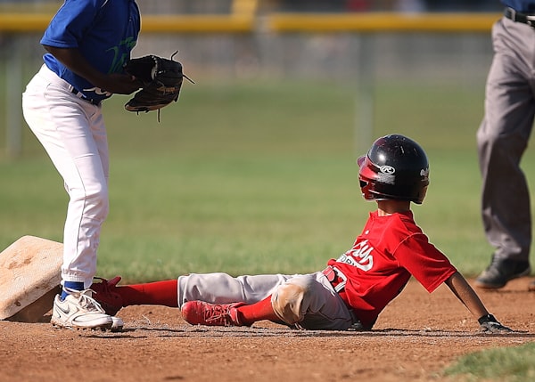 Two boys playing baseball