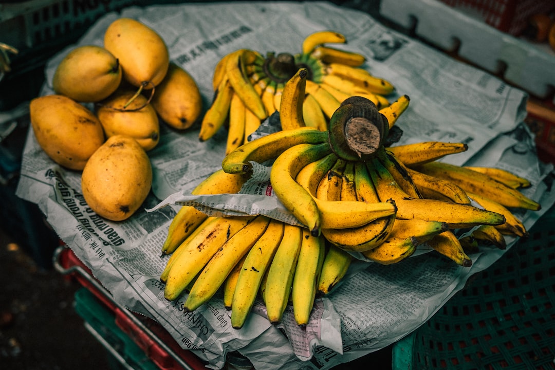 mangoes and bananas on newspaper, Yellow Gram In Dong Ba Market