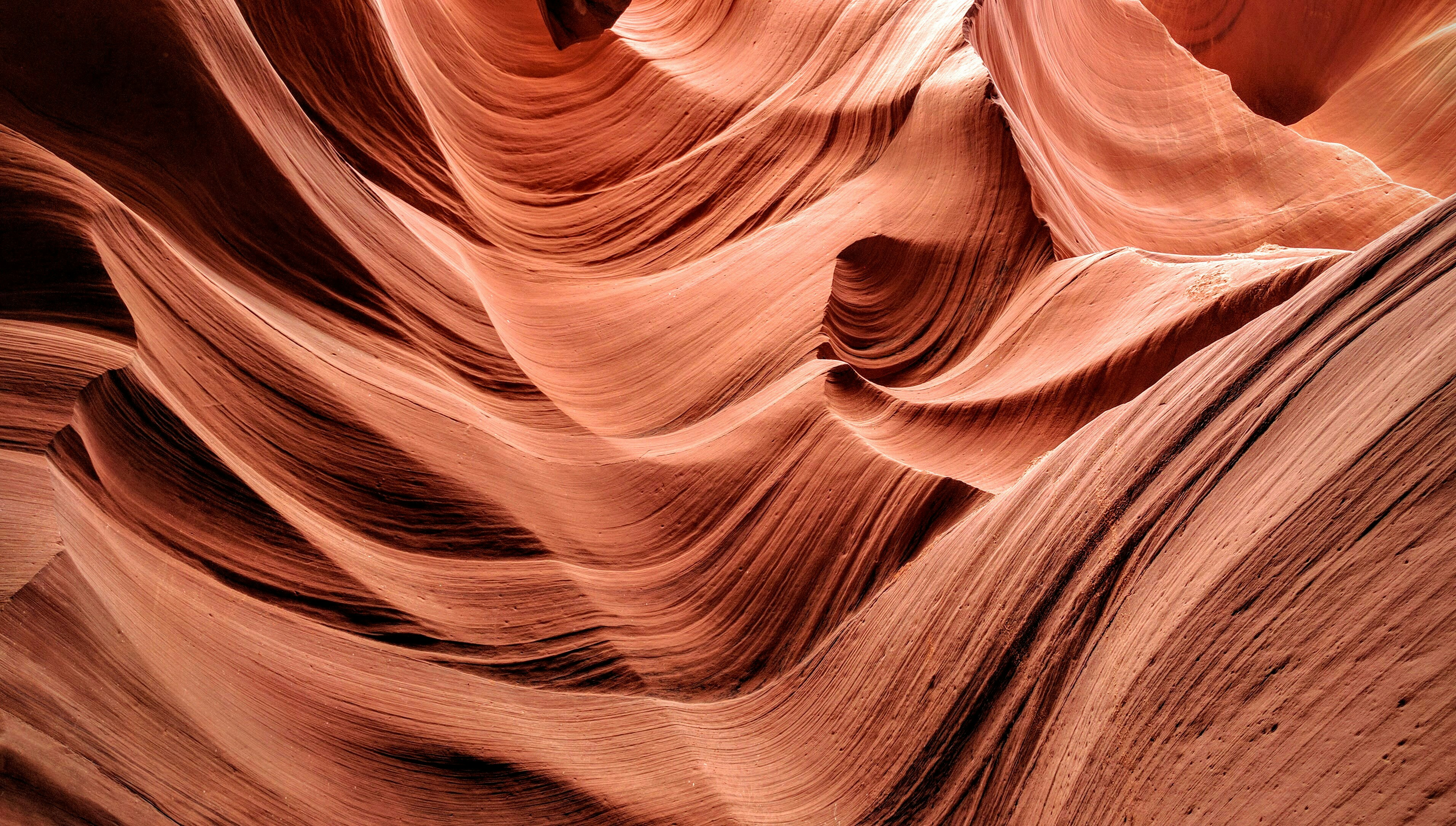 Antelope Canyon is a slot canyon in the American Southwest. It is located on Navajo land east of Page, Arizona. It was formed by erosion of Navajo Sandstone, primarily due to flash flooding. Rainwater runs into the extensive basin above the slot canyon sections, picking up speed and sand as it rushes into the narrow passageways. I visited this wonder of nature in the summer of 2016.