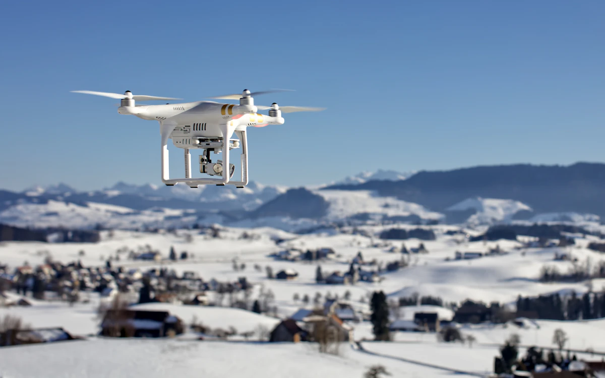 Drone over snow covered houses in Hirzel