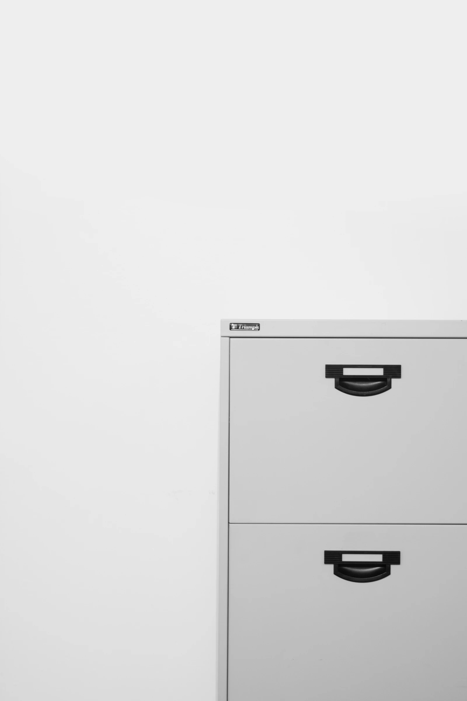 Gray metal locker on white surface