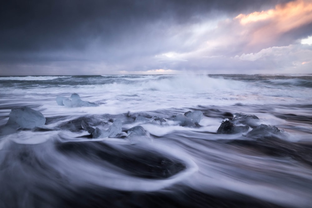 ocean waves under gray cloudy sky during daytime