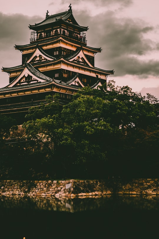 beige and black concrete castle in Hiroshima Castle Japan