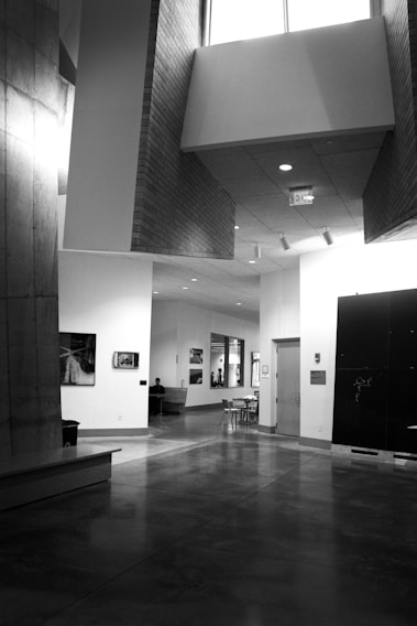 A freshly finished concrete floor gleaming under natural light in a modern commercial space.