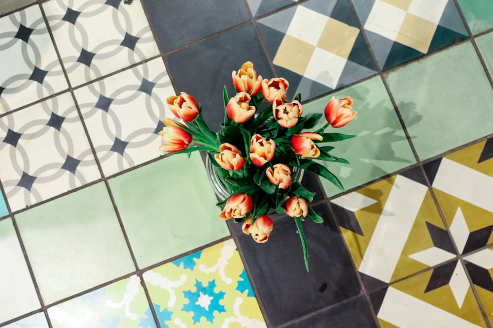 orange and red flowers on blue and white checkered textile