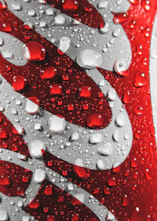 Close-up of a wattors water sachet glistening with fresh droplets