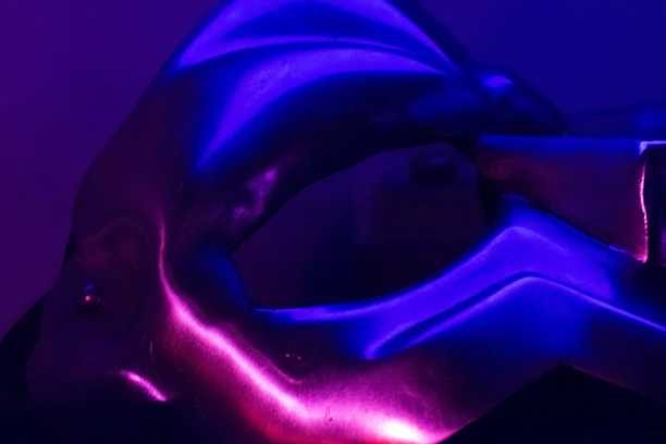 Close-up of a freshly powder-coated metal part with a smooth, glossy finish under soft lighting.