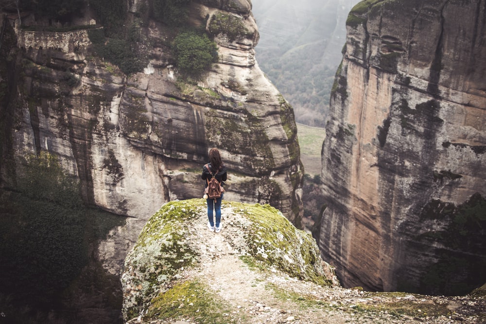 woman standing near cliff