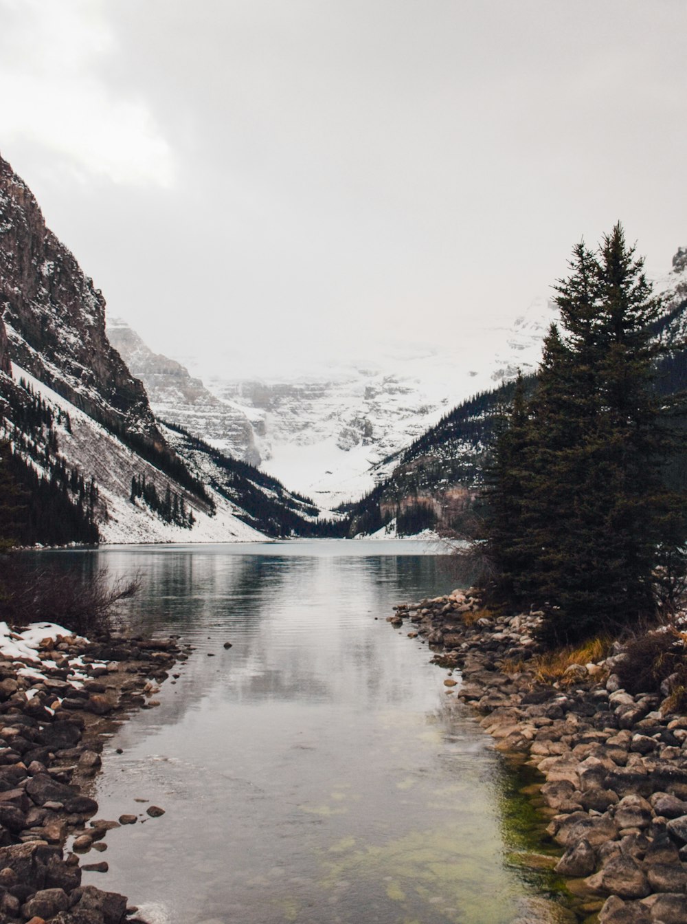 landscape photography of mountains and body of water