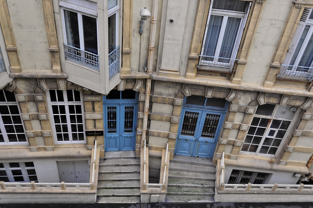 top view of beige, blue, and brown concrete building at daytime