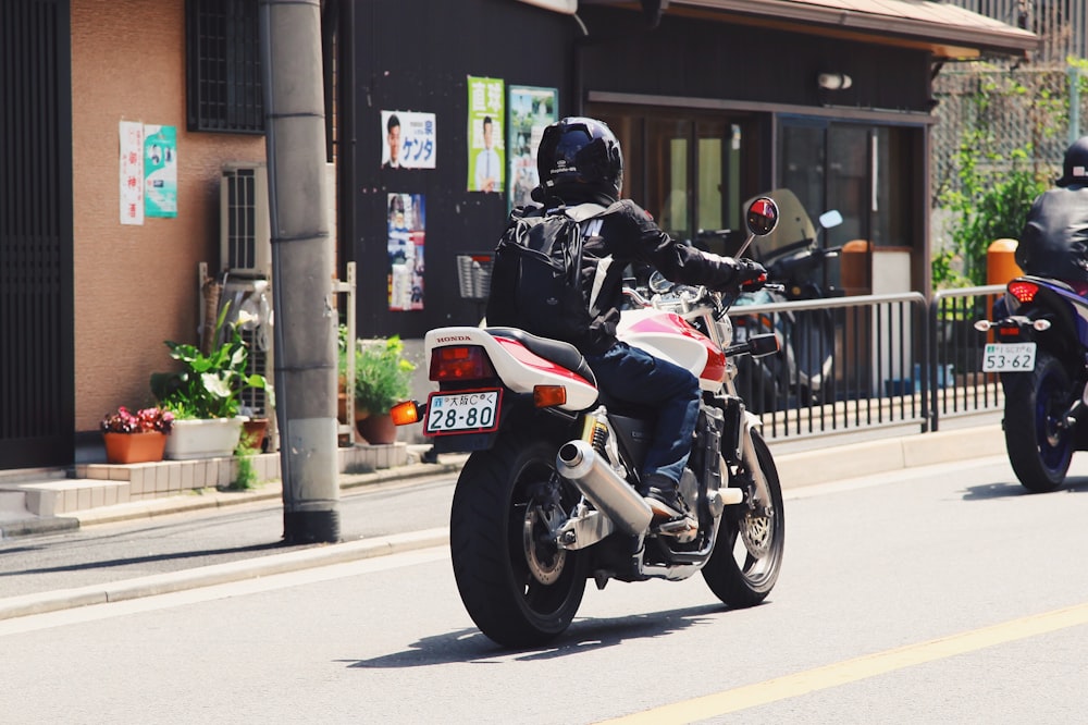 person riding sports bike