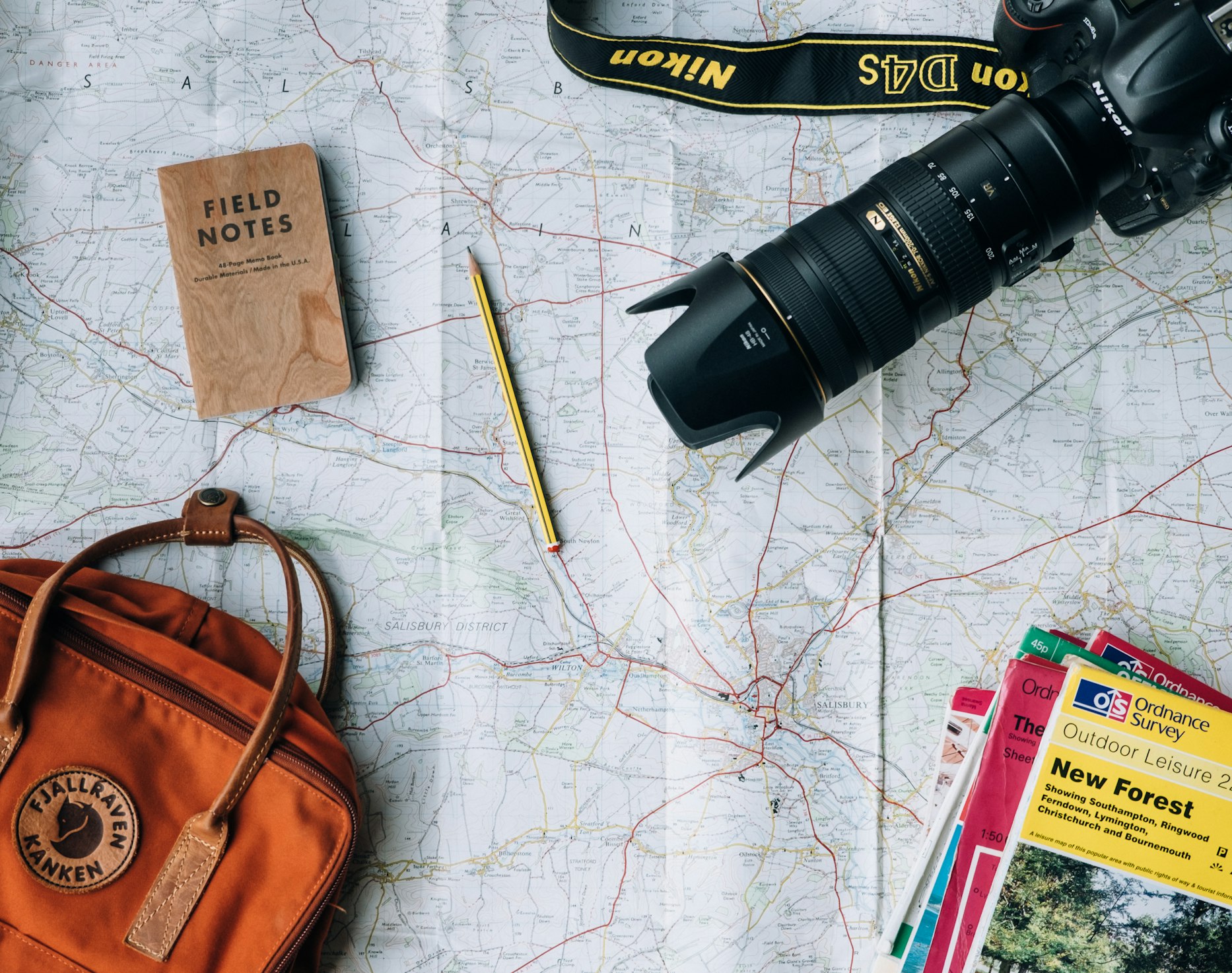 Travel gear laid out on a map