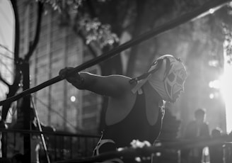 man in mask inside wrestling ring