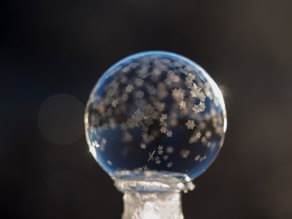 shallow focus photography of bubble with snowflakes