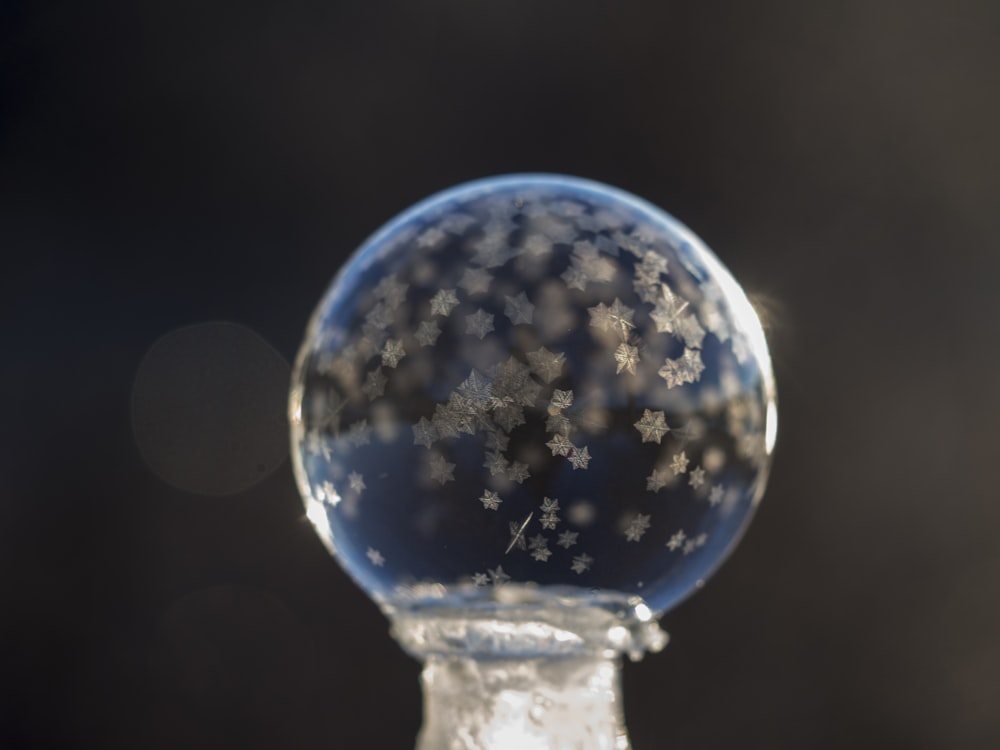 shallow focus photography of bubble with snowflakes