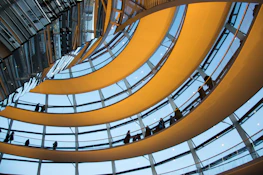 A dynamic walkthrough animation still featuring a stylish, illuminated interior space with rich materials.