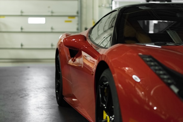 close-up photography of red coupe
