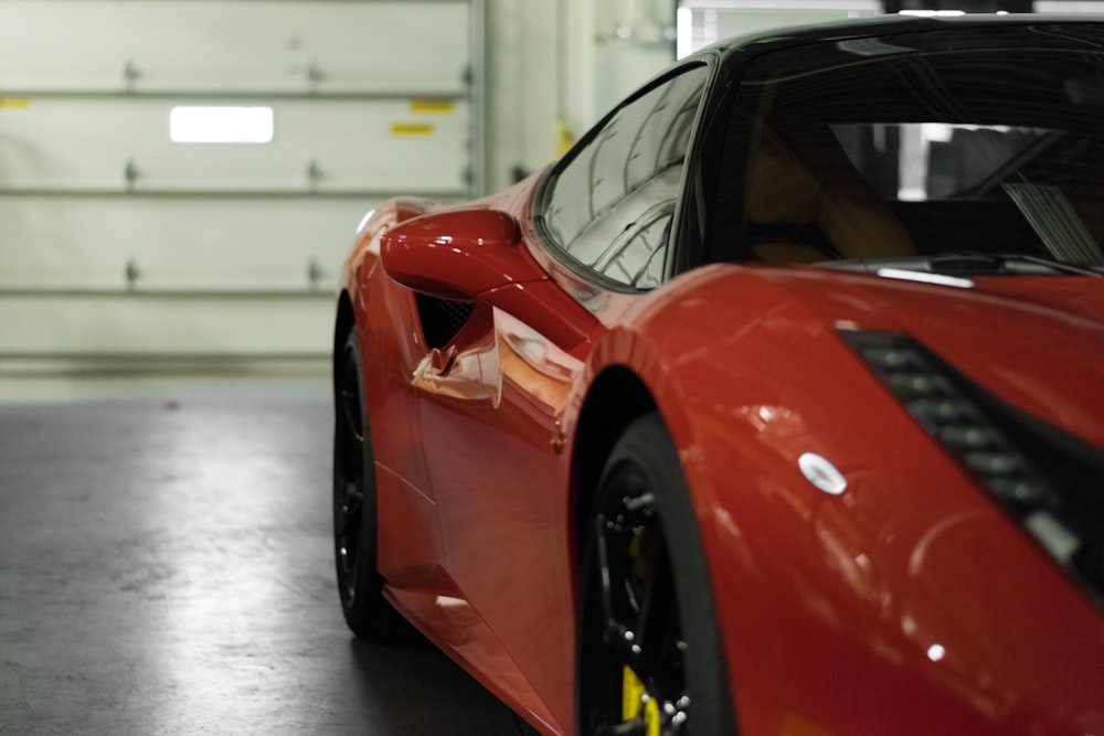 close-up photography of red coupe