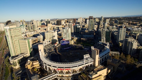 Aerial view of a stadium with drones scanning tickets from above, highlighting the integration of sky scanning technology.