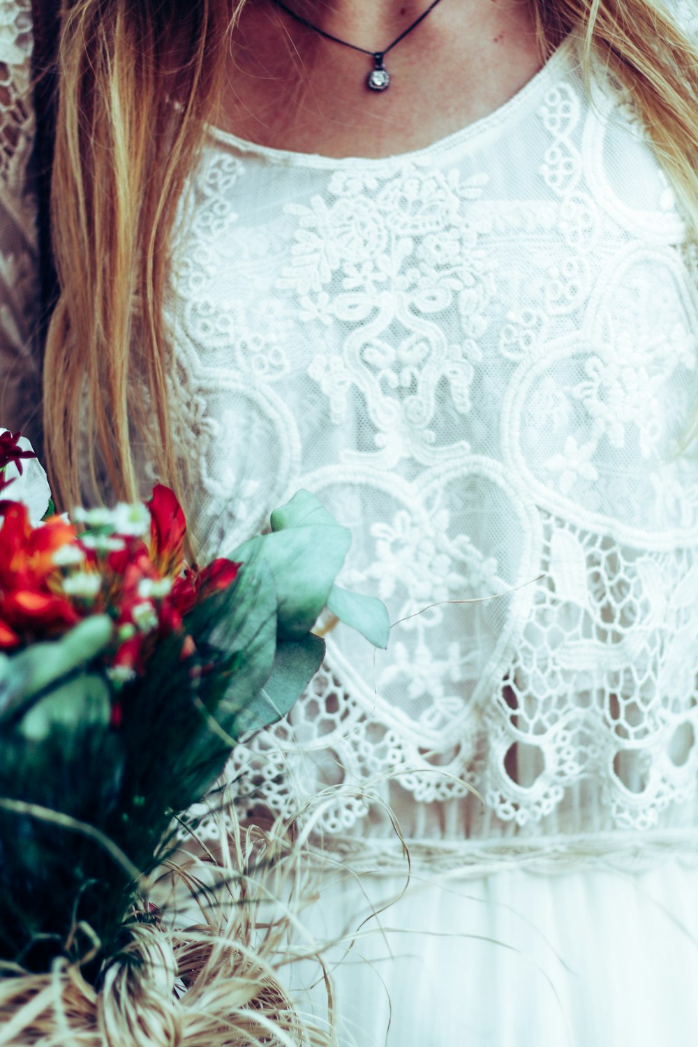 woman in white lace top