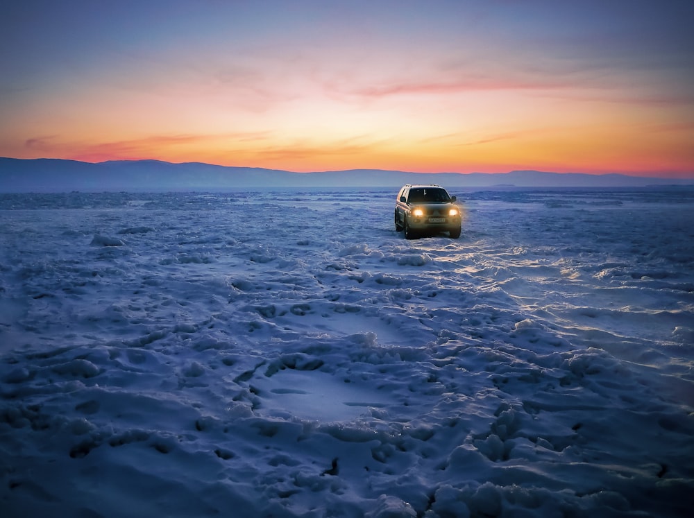 car on snow pavement